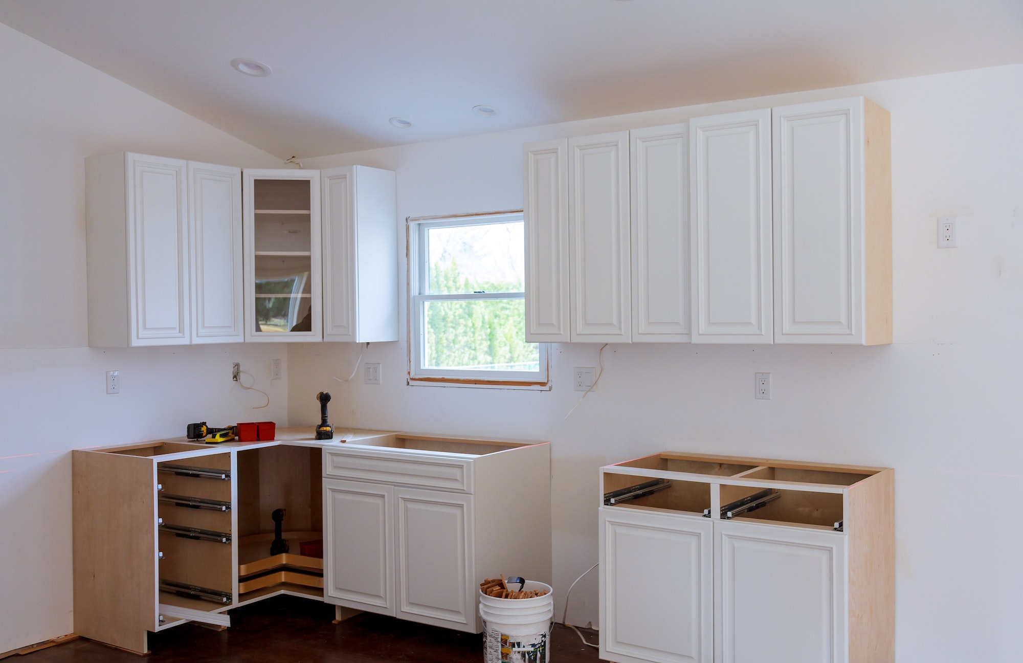 Kitchen remodel furniture installation accessories and tools adjustment on kitchen cabinets