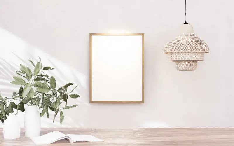 Modern room with framed artwork, pendant light, and plants showcasing interior painting in Federal Way.