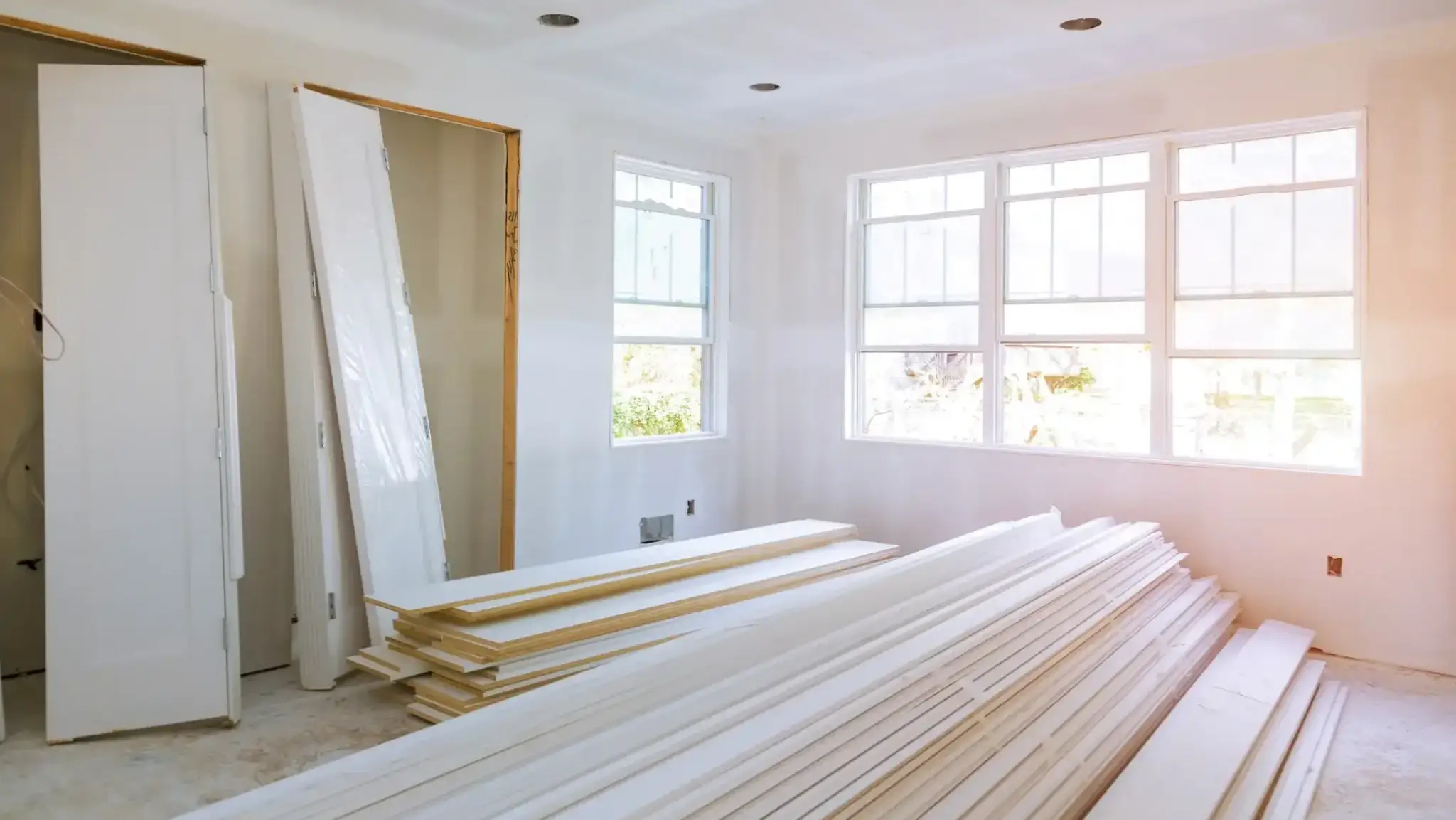 Materials staged for a general remodel in South King County with sunlight streaming through new windows.