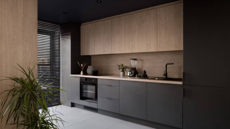 Modern kitchen with wood tone cabinet color and matte black lower cabinets.